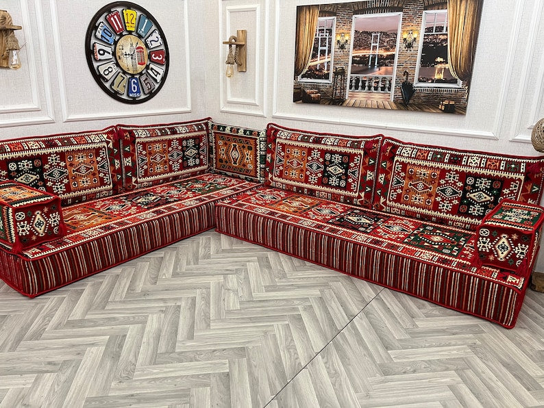 8 inch L shaped Arabic Majlis sofa set in vibrant red and ethnic patterns, ideal for cozy living room seating.